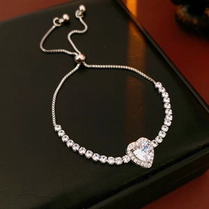 Macro shot of silver heart zircon bracelet with adjustable sliding box chain for women