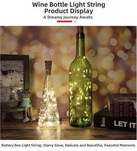 Close-up of LED cork bottle lights with warm copper wire glow in creative glass bottles