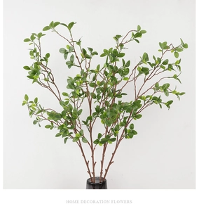 Detailed view of artificial Milan leaves branch with natural green foliage for home decor
