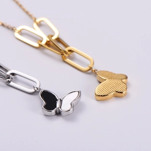 Fashion butterfly shell pendant necklaces in gold and silver finishes on link chains
