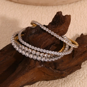 Close-up of 18K gold plated stretch tennis bracelets with shiny cubic zirconia stones