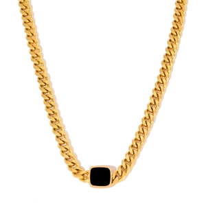 Chunky gold Cuban link necklace featuring a bold black square pendant for a unisex style