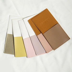 Fan-shaped display of dual-color PU leather drawstring pouches in six color combinations