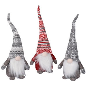 Three Nordic Christmas gnomes with long beards in red and grey knitted hats for decor