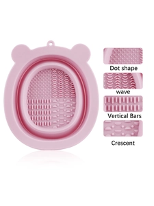 Detail of pink bear-shaped silicone makeup brush mat showing four cleaning textures
