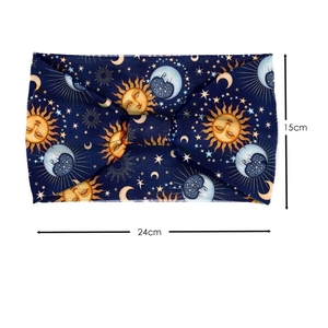 Detail view of navy blue yoga headband with sun and moon print and 24cm by 15cm dimensions