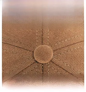 Macro view of the brown twill fabric cap top with a matching button and reinforced stitching