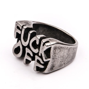 Close-up of vintage steel ring featuring bold 3D Fuck Off lettering in retro silver finish
