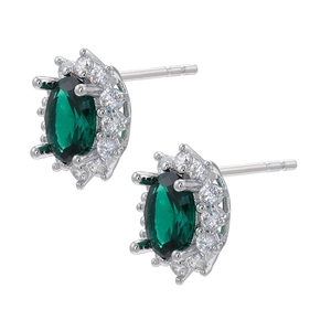 Detail of oval green gemstone earrings with white zircon halo in a claw setting