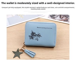 Detail of light blue faux leather coin purse with lychee texture and tassel charm