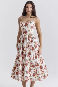 Detail of floral backless dress with vintage flower print and delicate spaghetti straps
