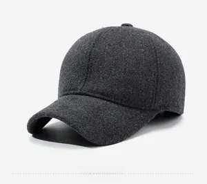 Close-up of the grey wool blend fabric texture and black 'R' logo on the baseball cap