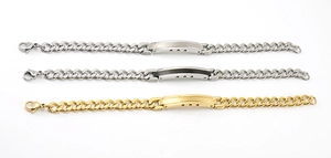 Detailed comparison of three stainless steel Cuban link bracelets in gold, silver, and black