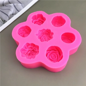 Detailed macro view of pink silicone mold with seven rose flower cavity patterns