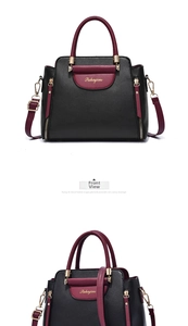 Detail of two-tone PU leather handbag in black and burgundy with metallic side zipper