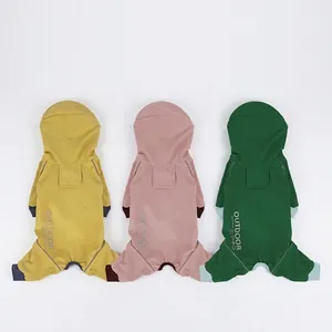 Three colors of hooded pet raincoats with reflective strips and back pockets in plain view