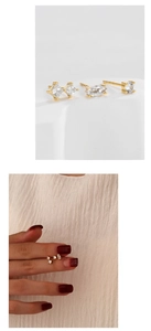 Detail of three-piece gold plated S925 silver stud earrings with clear zircon stones