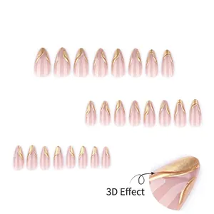3D gold embossed almond press on nails in nude pink with elegant wavy patterns