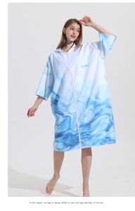 Quick-dry hooded changing robe featuring a blue marble wave print and front zipper closure
