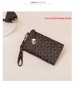 Detail of the geometric pattern storage pouch with leather wristlet and gold zipper
