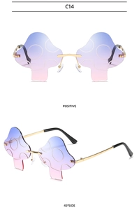 Detail of rimless mushroom sunglasses with blue-pink gradient lenses and gold metal temples