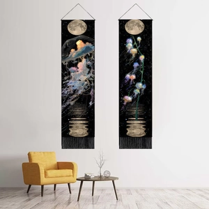 Nordic jellyfish wall tapestry with black tassels hanging above a cozy yellow armchair