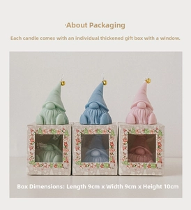 Three gnome scented candles in pastel colors with gold bells and gift packaging boxes