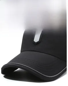 Detail of a curved brim black baseball cap with an R logo and reinforced stitching