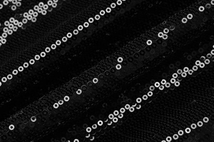 Gros plan d'un tissu à paillettes noires scintillantes pour robes de soirée élégantes