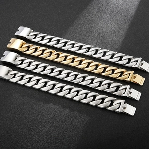 Detail of silver and gold Cuban link bracelets in polished stainless steel for men