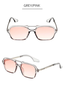 Detail view of double bridge aviator sunglasses with grey frame and pink gradient lenses