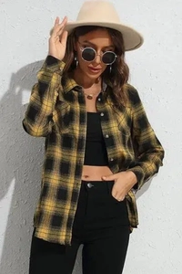 Detail of yellow and black flannel plaid shirt featuring turn-down collar and black buttons