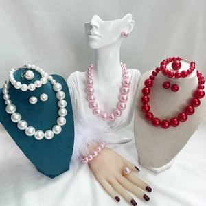 Detailed display of elegant pearl jewelry sets in white, pink and red colors
