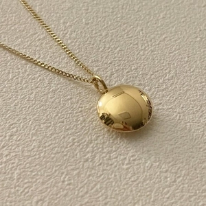 Polished golden bean pendant necklace with delicate minimalist chain for women