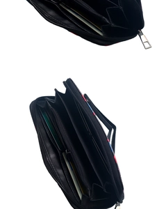 Detailed interior view of a black zipper wallet showing card slots and coin pocket