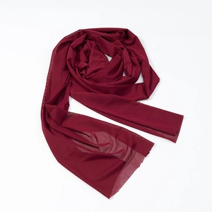 Detail of burgundy mesh scarf accessory with a light, semi-transparent fabric texture