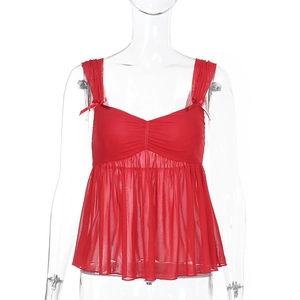 Detail of red mesh camisole featuring front ruching and a delicate bow tie decoration