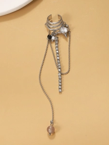 Close-up of silver long tassel ear cuff with rhinestones and pearl drop detail