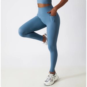 Close-up of high-waist yoga pants with side pockets and premium stitching details