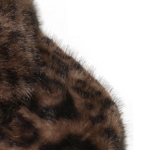 Macro shot of brown faux fur texture with high-quality leopard print jacquard pattern