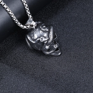 Retro stainless steel pendant featuring a detailed snake coiled around a skull with box chain