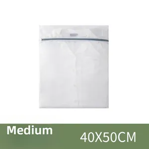 Close-up of a medium 40x50cm fine mesh laundry bag with white shirt and zipper detail