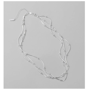 Detail of S925 sterling silver triple layer snake chain necklace with small beads