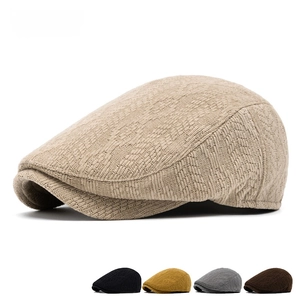 Knit newsboy beret for men and women showing textured fabric in multiple colors