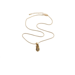 Golden necklace with a zircon-studded sneaker shoe pendant on a clean white background