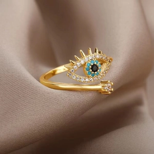 Luxurious gold evil eye open ring featuring blue beads and sparkling white zircons