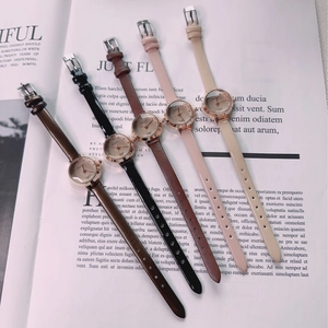 Detailed flat lay of five vintage rectangular quartz watches with colorful leather straps