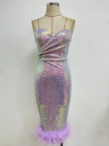 Detail of purple sequin dress with fluffy feather trim and elegant mermaid fishtail hem