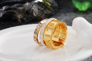Close-up of three-piece Roman numeral ring set with gold plating and zircon inlay