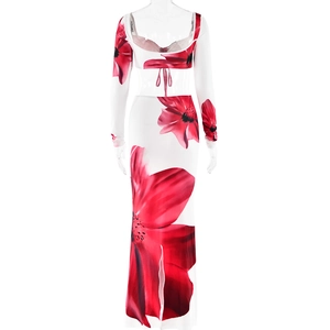 Detail view of white chiffon two-piece set featuring large red floral prints and back lacing